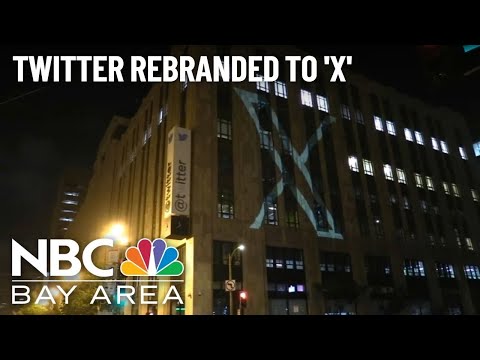 Elon Musk unveils his Twitter rebranding, with the ‘X’ logo projected on SF headquarters